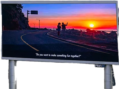 Roadside LED billboard showing a Korea Tourism sunset ad