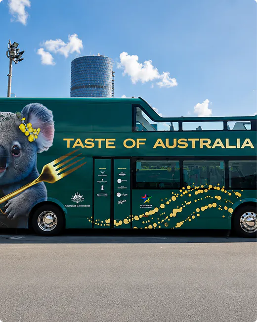 Taste of Australia bus wrap advertising on an open-top double-decker
