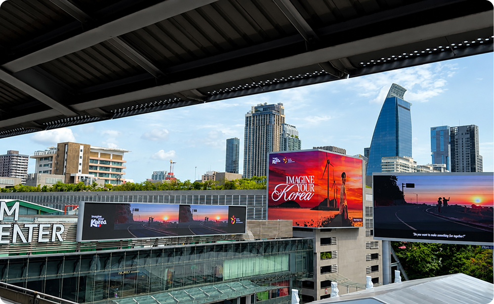 Korea Tourism outdoor billboards above a shopping centre in Bangkok, Thailand