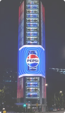 Pepsi campaign on a tall vertical LED screen at night